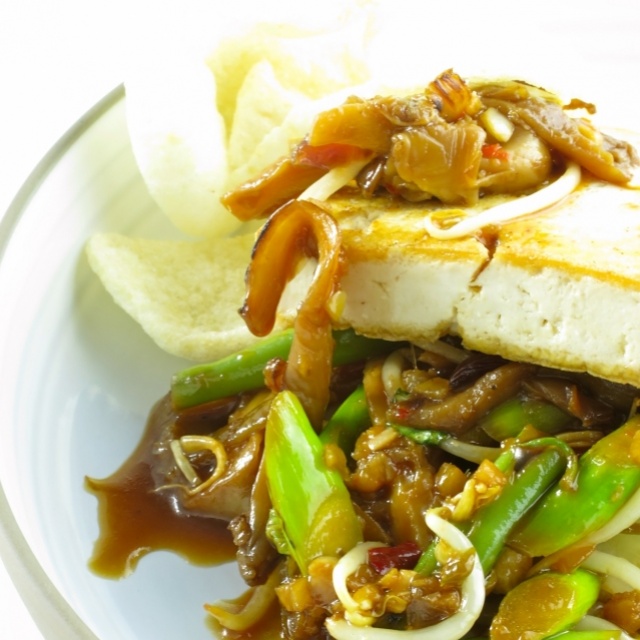 Tofu steak with wild mushrooms, pak choi and Indonesian soy sauce