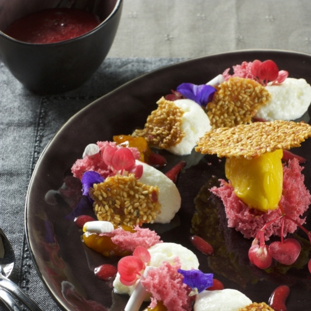 Yoghurt mousse with mango salsa and peach sorbet