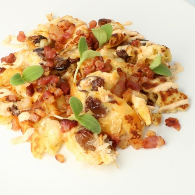 Kaiserschmarrn with sauerkraut and smoked bacon cubes 