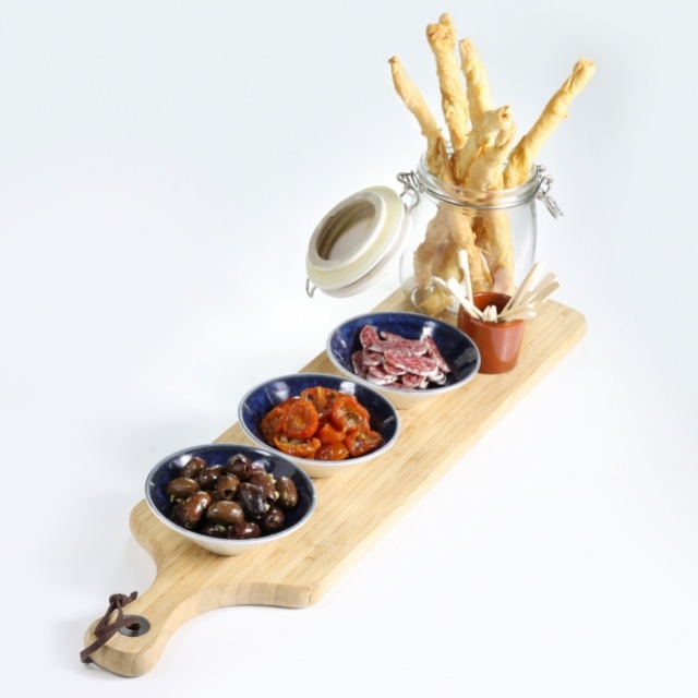 Selection of drinks snacks with sweet-and-sour cherry tomatoes